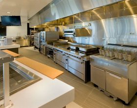 Commercial kitchen with pizza oven.